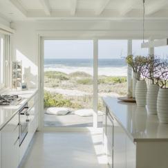 Modern white kitchen with ocean view